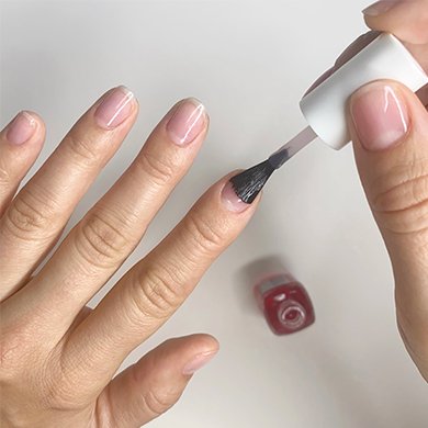 hand brushing on essie hard to resist nail strengthener