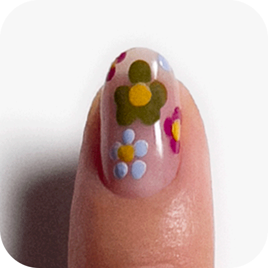 Nail with floral multi-color nail art and topped with a glossy top coat