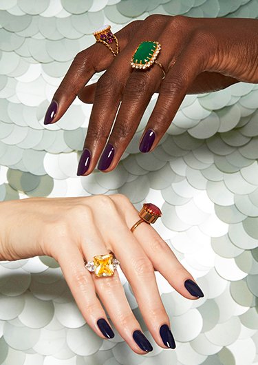 Dark skin model wearing statement rings with nails in underground ball essie nail